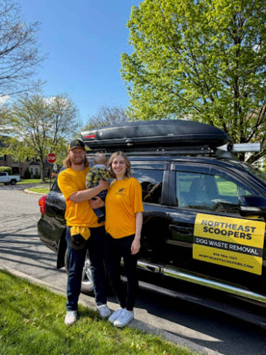 The Northeast Scoopers team by their service vehicle